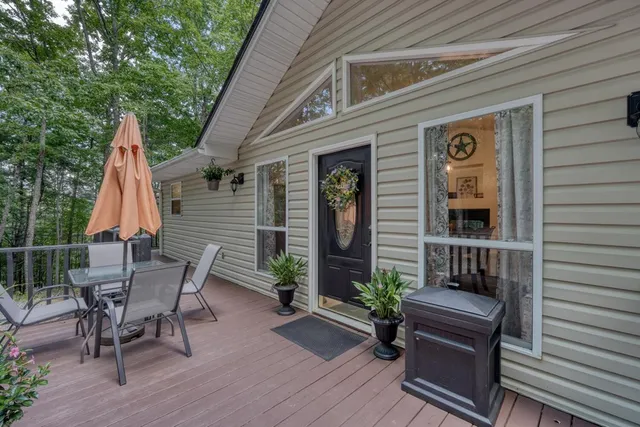 a view of a patio with a table and chairs
