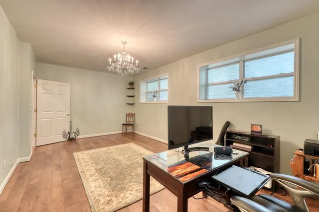 a view of a livingroom with furniture and wooden floor