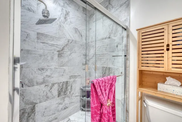 a living room with furniture a air conditioner vent and a window