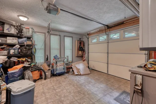 a view of a patio with a dining table and chairs