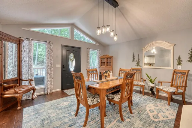 a view of a dining room with furniture window and outside view