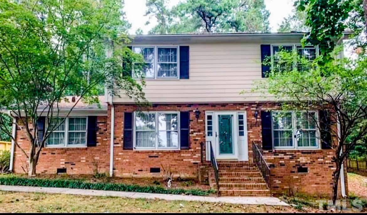 5601 Russell Road Durham, NC 27712 - Photo 1 of 10 a front view of a house with garden