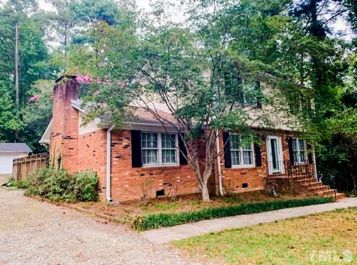 5601 Russell Road Durham, NC 27712 - Photo 2 of 10 a front view of a house with garden