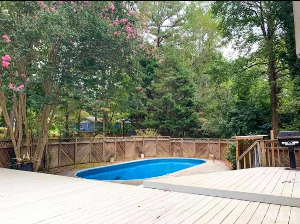 5601 Russell Road Durham, NC 27712 - Photo 3 of 10 a view of a swimming pool with an outdoor seating