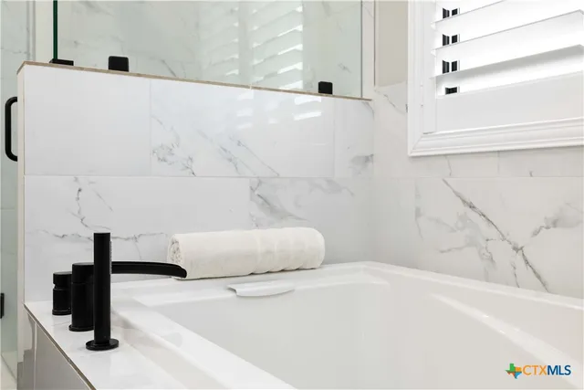 a bathroom with a bathtub