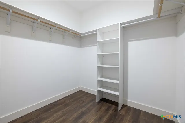 a view of an empty walk in closet
