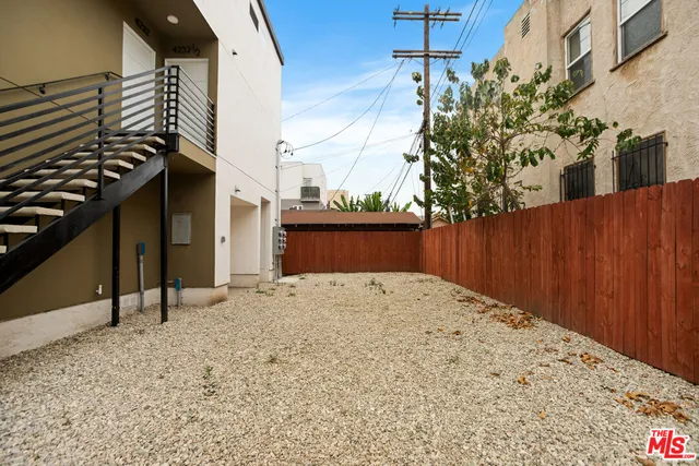 a view of a backyard of the house