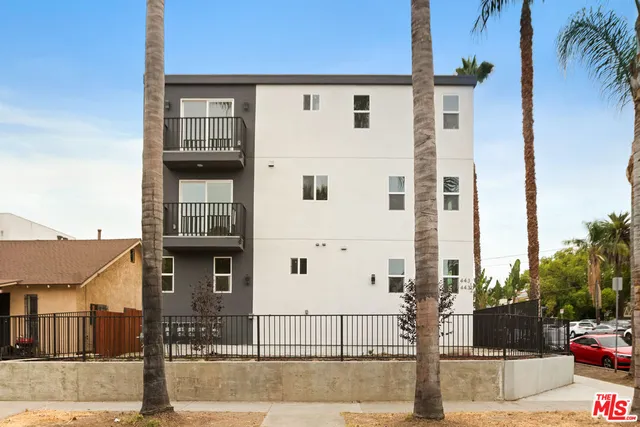 a front view of a building with street view