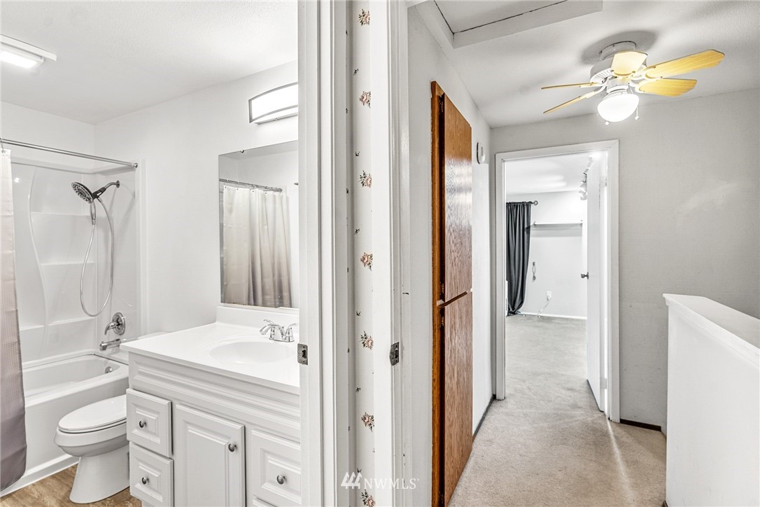 21527 4th Avenue West, Unit C43 Bothell, WA 98021 - Photo 24 of 27 a bathroom with a sink a toilet and shower