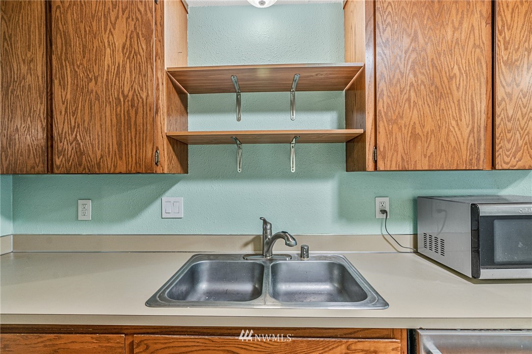 21527 4th Avenue West, Unit C43 Bothell, WA 98021 - Photo 6 of 27 a kitchen with a sink and cabinets