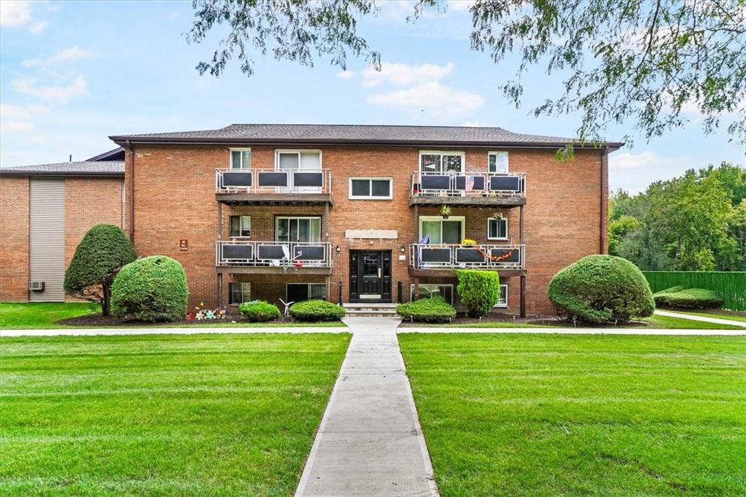 25 Tanager Road, Unit 2502 Monroe, NY 10950 - Photo 1 of 1 a front view of a house with a yard and garage