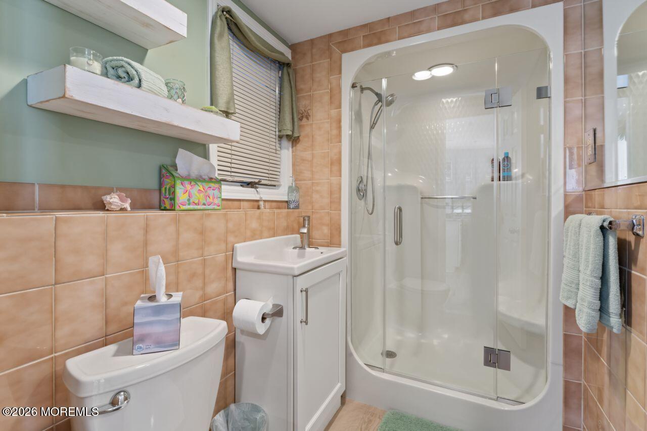 151 Riverside Drive North Brick, NJ 08724 - Photo 22 of 52 a bathroom with a shower a toilet and a sink