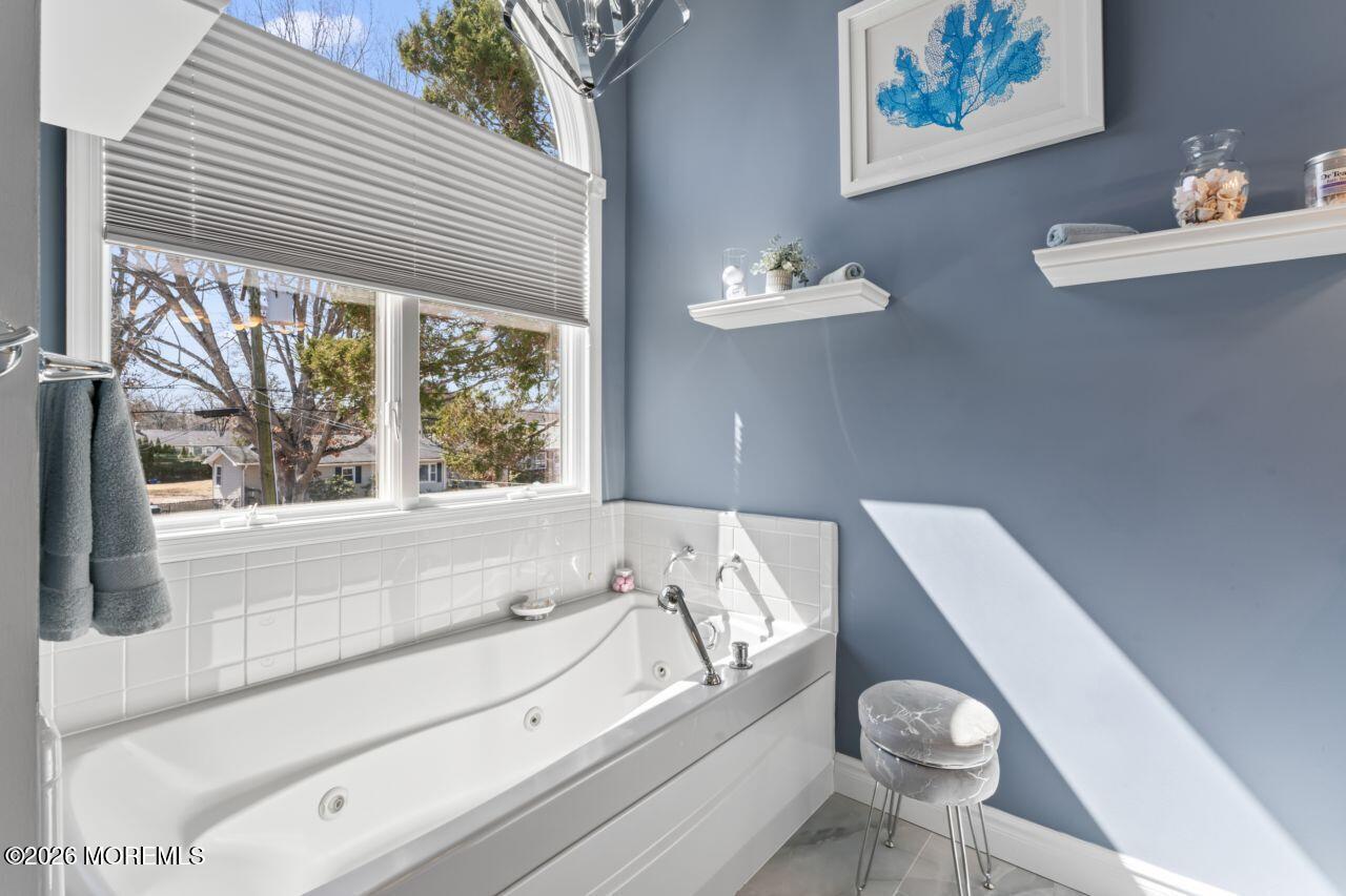 151 Riverside Drive North Brick, NJ 08724 - Photo 24 of 52 a bathroom with a bathtub and a sink