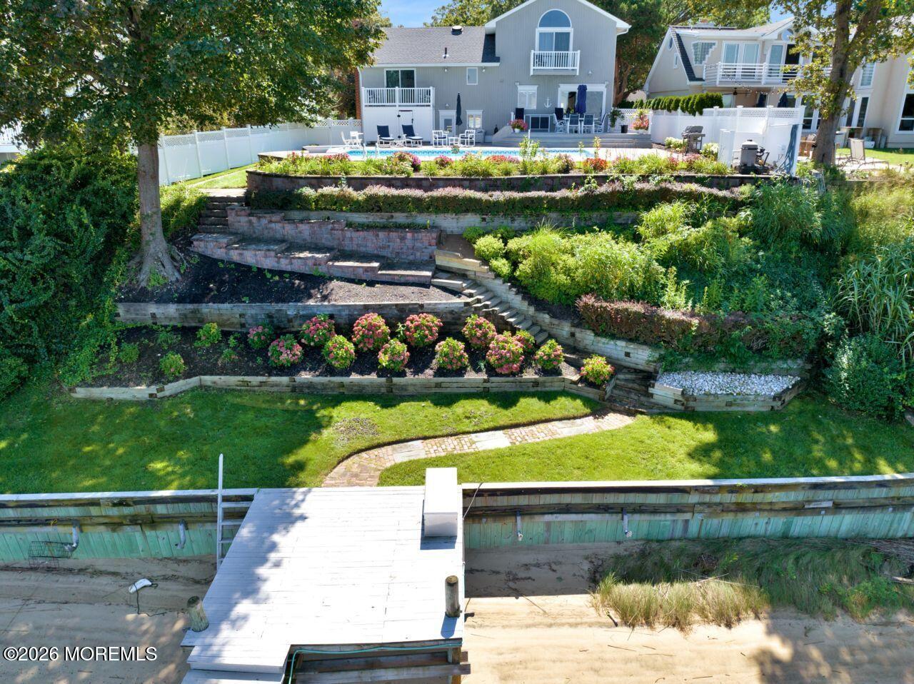 151 Riverside Drive North Brick, NJ 08724 - Photo 36 of 52 a view of swimming pool with outdoor seating and lake view