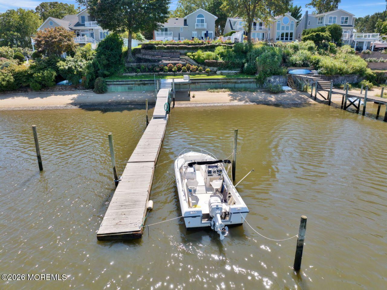 151 Riverside Drive North Brick, NJ 08724 - Photo 39 of 52 a view of swimming pool with outdoor seating and lake view
