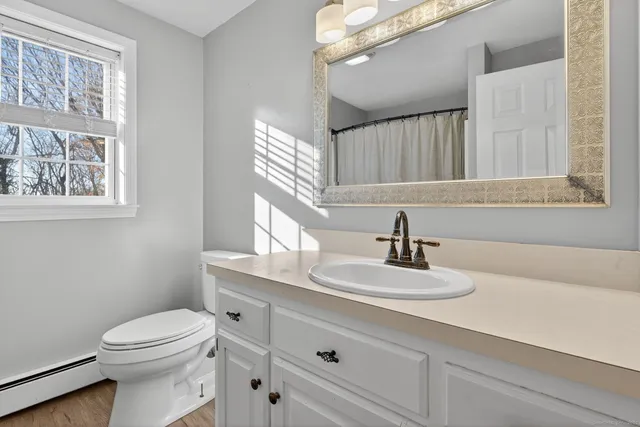 a bathroom with a double vanity sink and mirror
