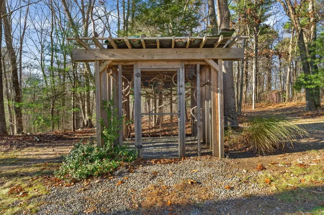 a swimming pool with outdoor seating and yard