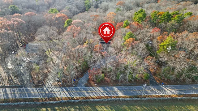 a view of a city with green field