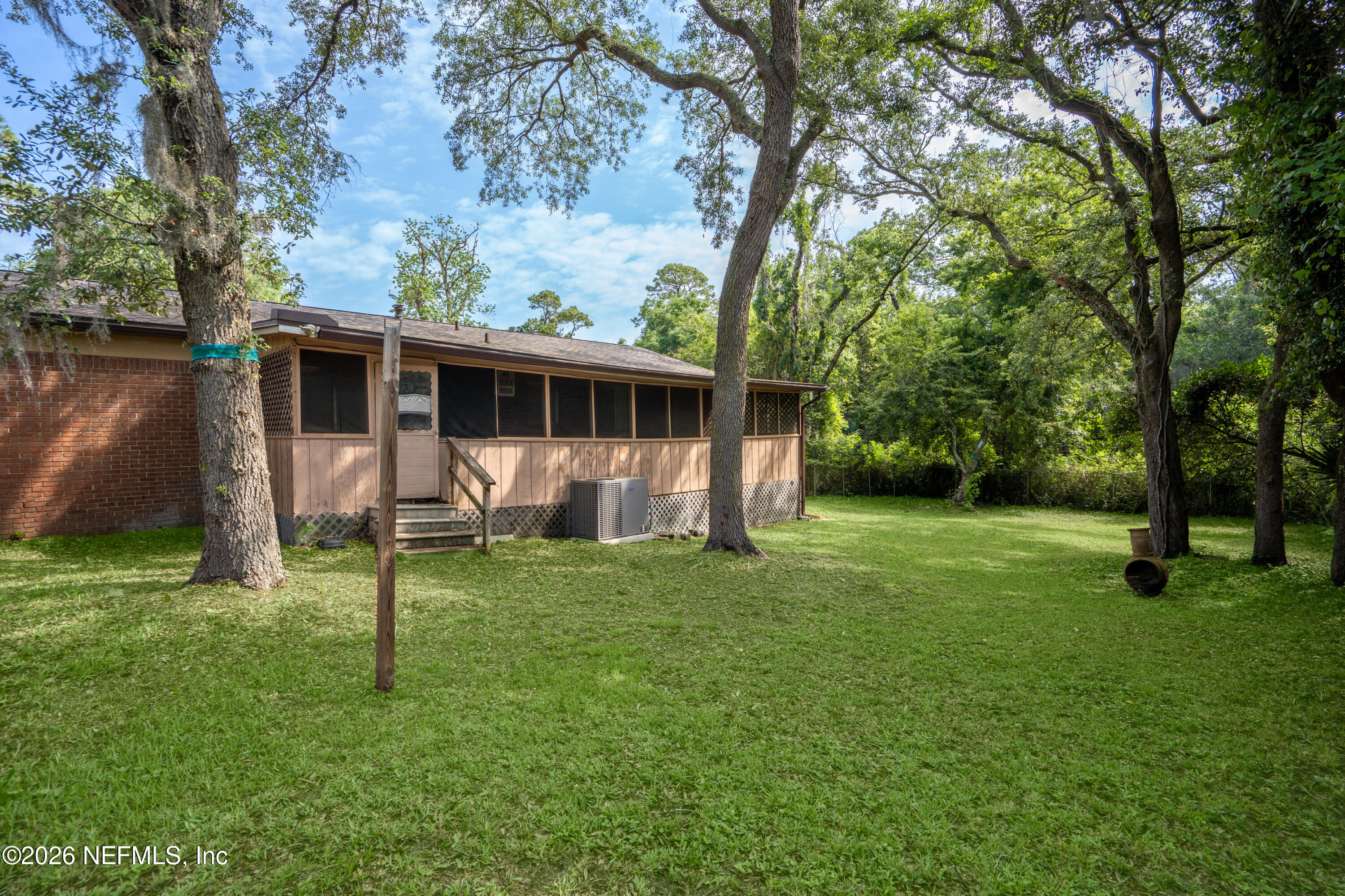 253 Cowry Road St. Augustine, FL 32086 - Photo 24 of 27 a view of a house with a backyard