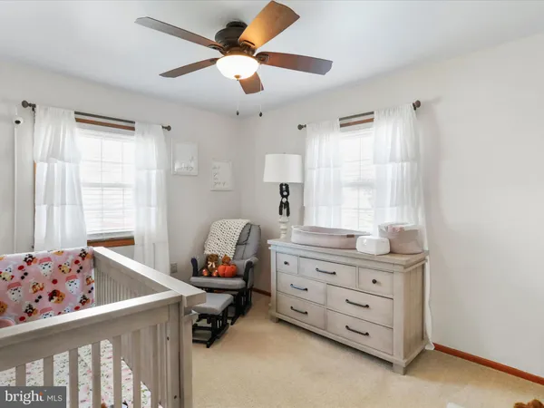 a room that has a dresser and a chair in it