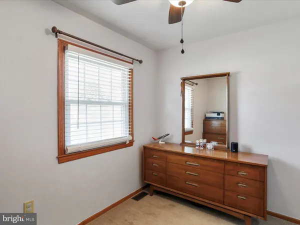 a room with a dresser and a mirror