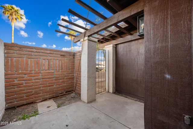 a view of kitchen with sink microwave and refrigerator