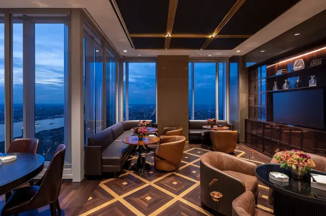 a media room with lots of chairs and a projector screen