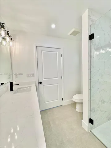 an empty room with a bathroom