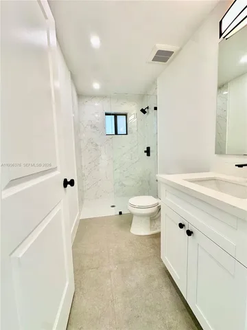 a view of a room with wooden floor and window