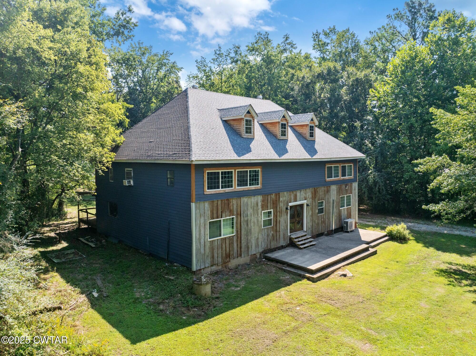 1035 Beacon Road Parsons, TN 38363 - Photo 1 of 70 a front view of a house with a yard