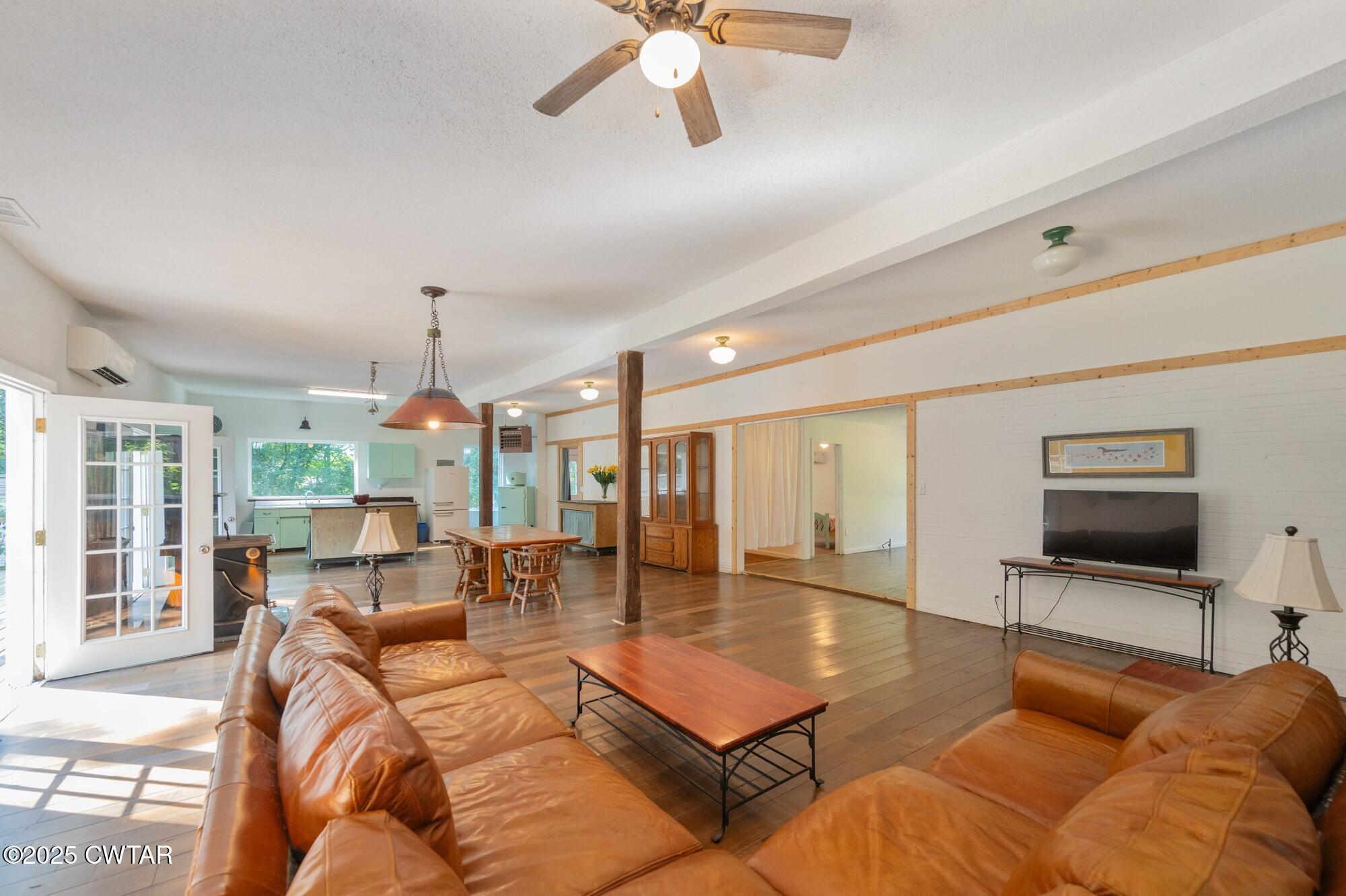 1035 Beacon Road Parsons, TN 38363 - Photo 15 of 70 a living room with furniture a flat screen tv and a large window