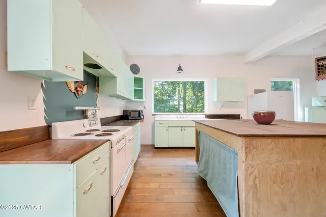 a bathroom with a sink and a shower curtain