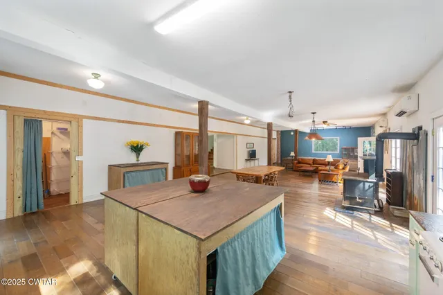 a spacious bedroom with a bed and window