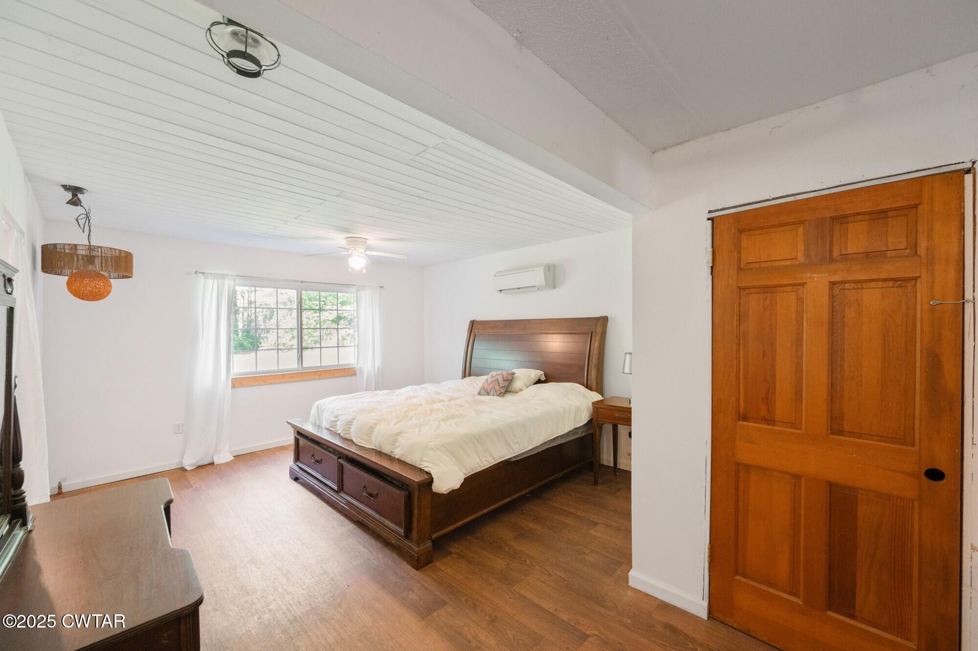 1035 Beacon Road Parsons, TN 38363 - Photo 24 of 70 a spacious bedroom with a bed and window