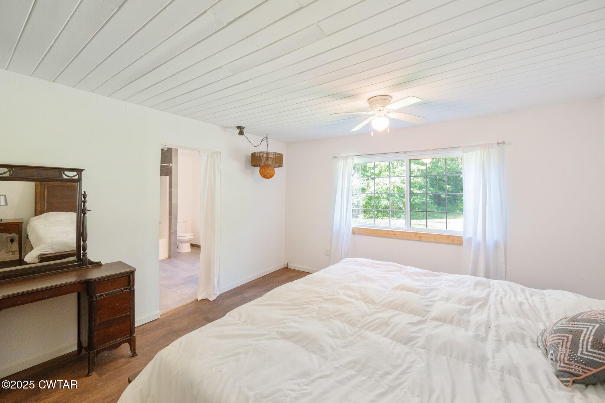 1035 Beacon Road Parsons, TN 38363 - Photo 25 of 70 a bedroom with a bed and a window