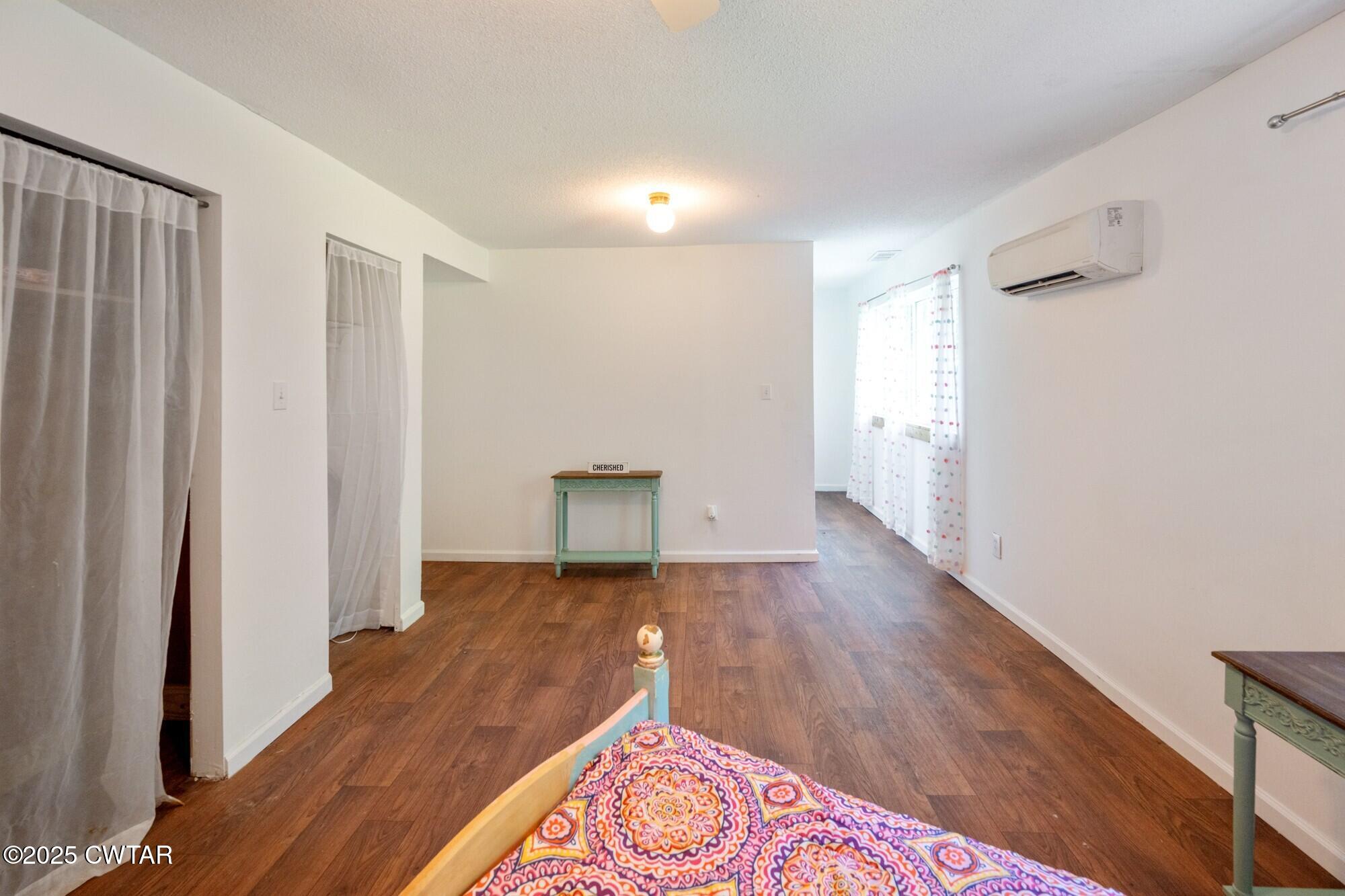 1035 Beacon Road Parsons, TN 38363 - Photo 30 of 70 a view of an empty room with wooden floor and a window