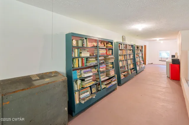 a view of a house with pool and chairs
