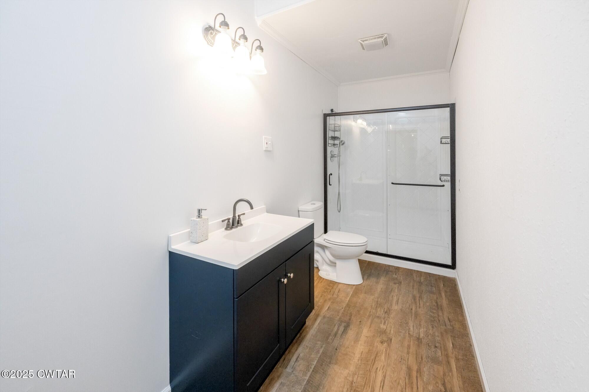 1035 Beacon Road Parsons, TN 38363 - Photo 42 of 70 a bathroom with a sink and a mirror