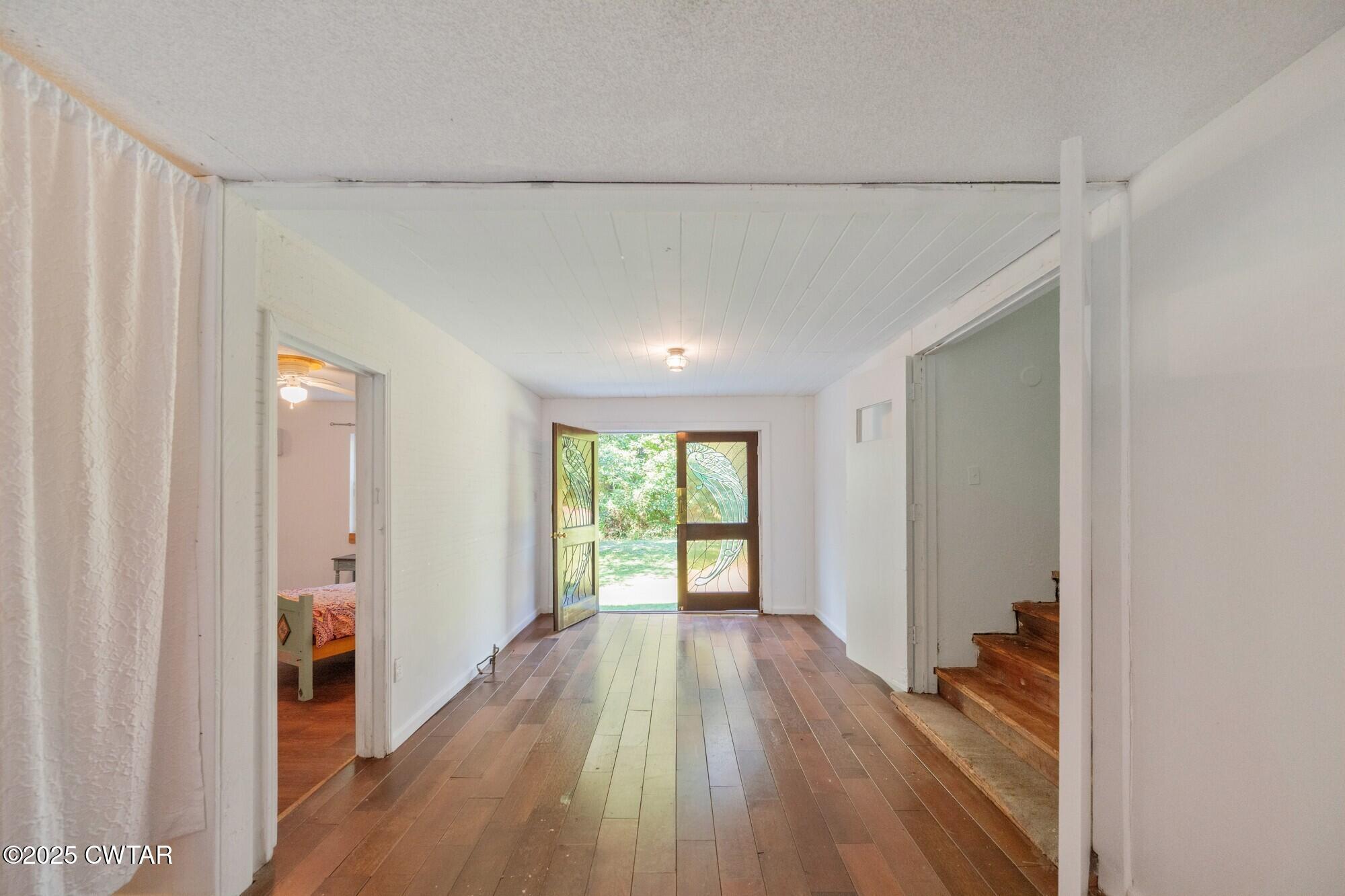 1035 Beacon Road Parsons, TN 38363 - Photo 5 of 70 a view of hallway with wooden floor and window