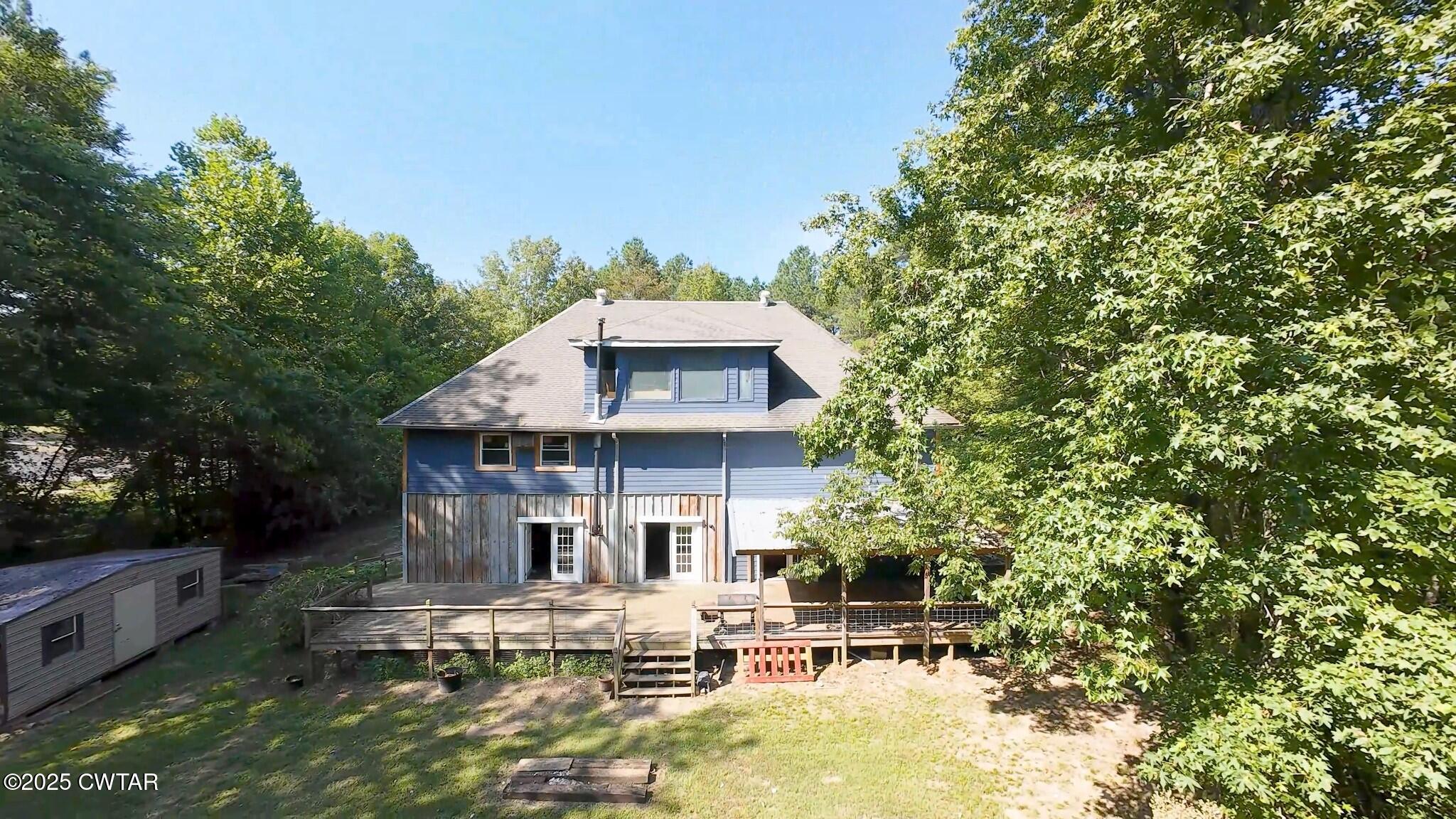 1035 Beacon Road Parsons, TN 38363 - Photo 52 of 70 a view of a house with pool and chairs