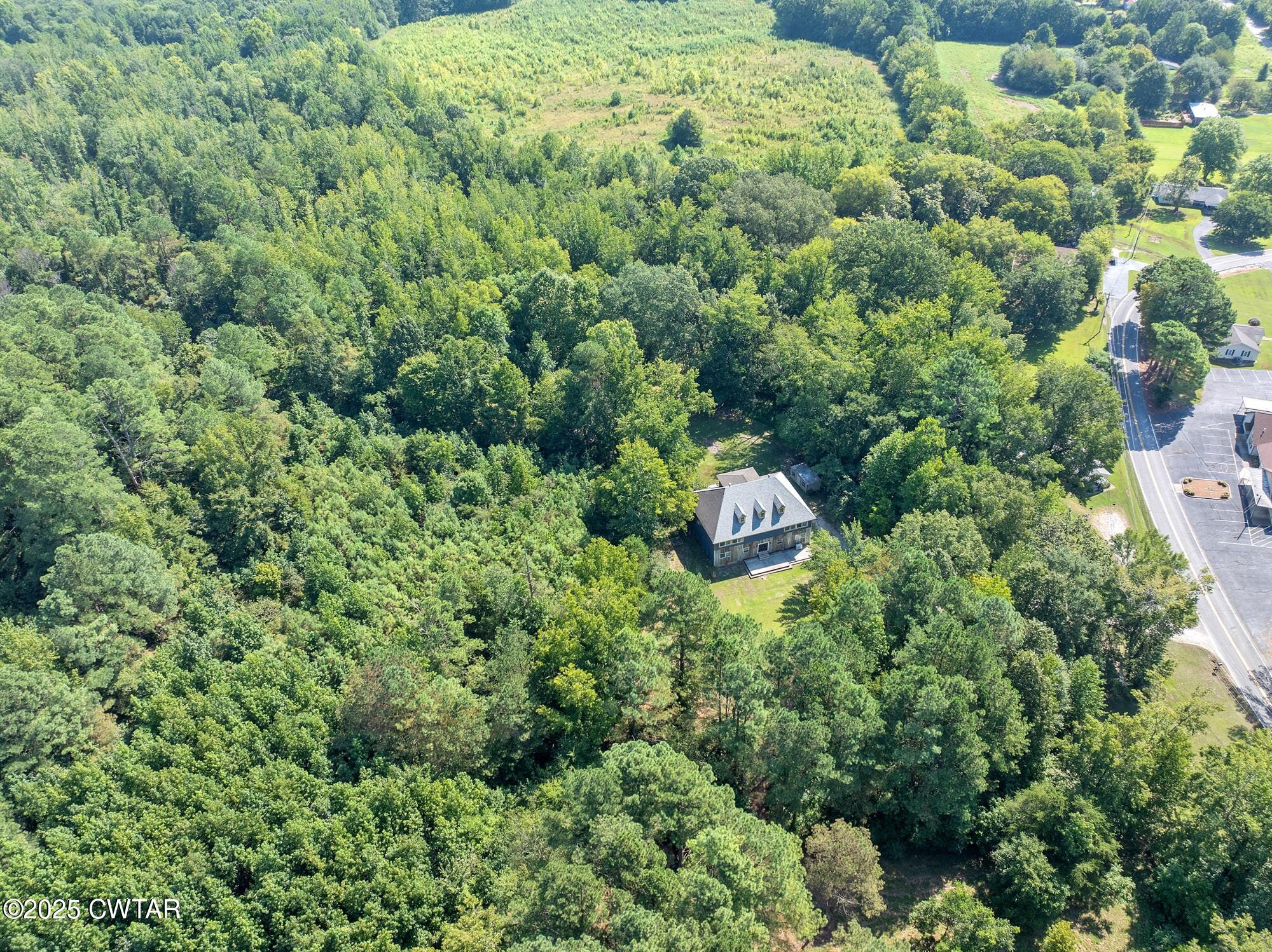 1035 Beacon Road Parsons, TN 38363 - Photo 59 of 70 an aerial view of residential house with outdoor space and trees all around