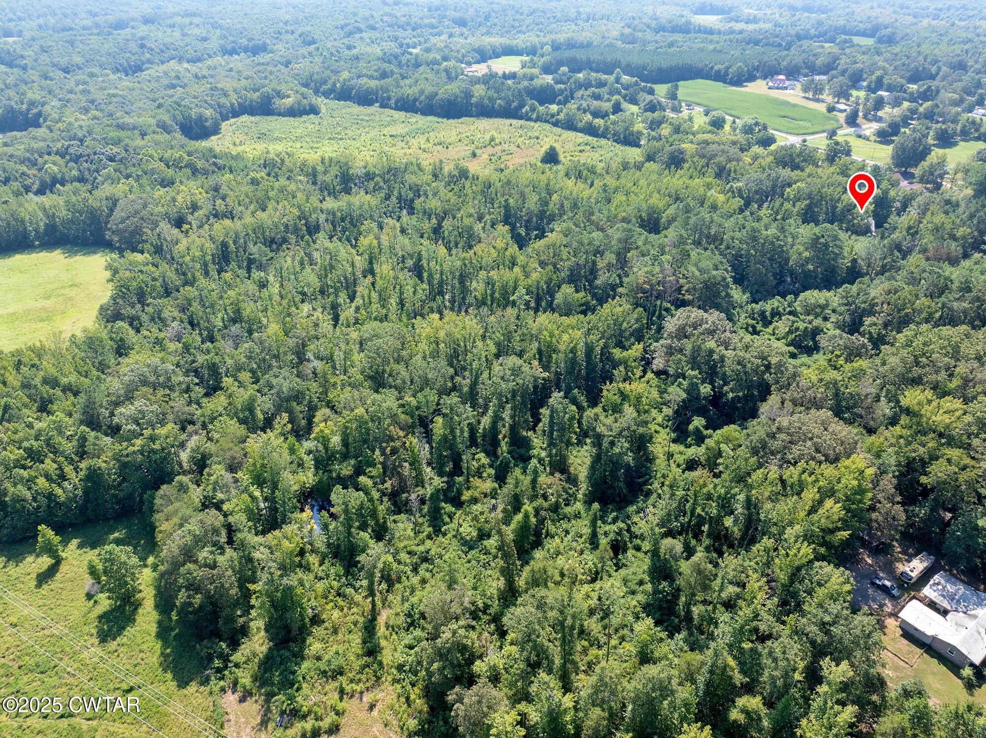 1035 Beacon Road Parsons, TN 38363 - Photo 62 of 70 an aerial view of residential house with outdoor space and trees all around
