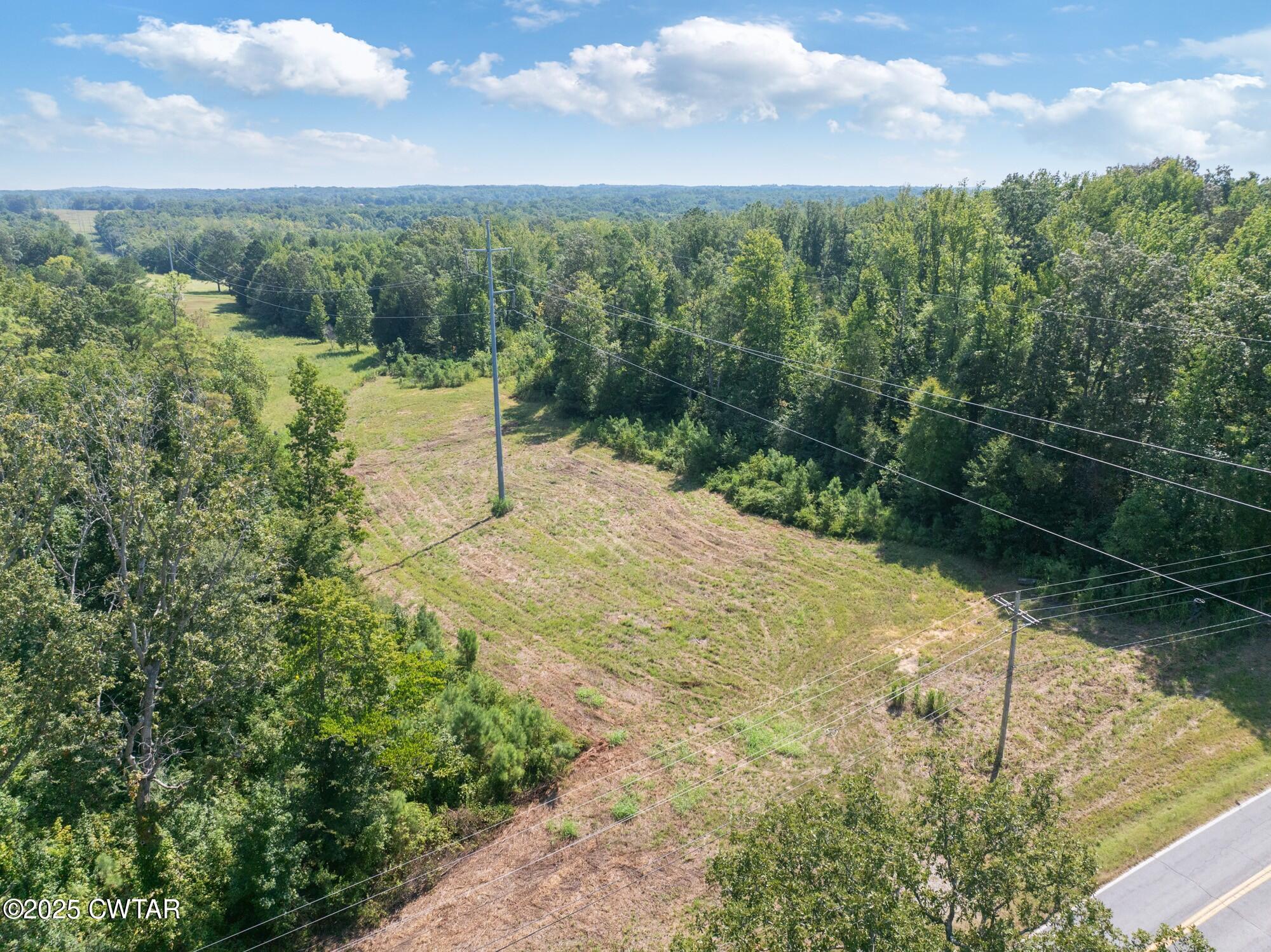 1035 Beacon Road Parsons, TN 38363 - Photo 66 of 70 a view of a lake with a yard