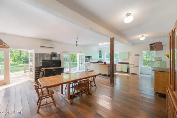 a dining room with furniture window wooden floor