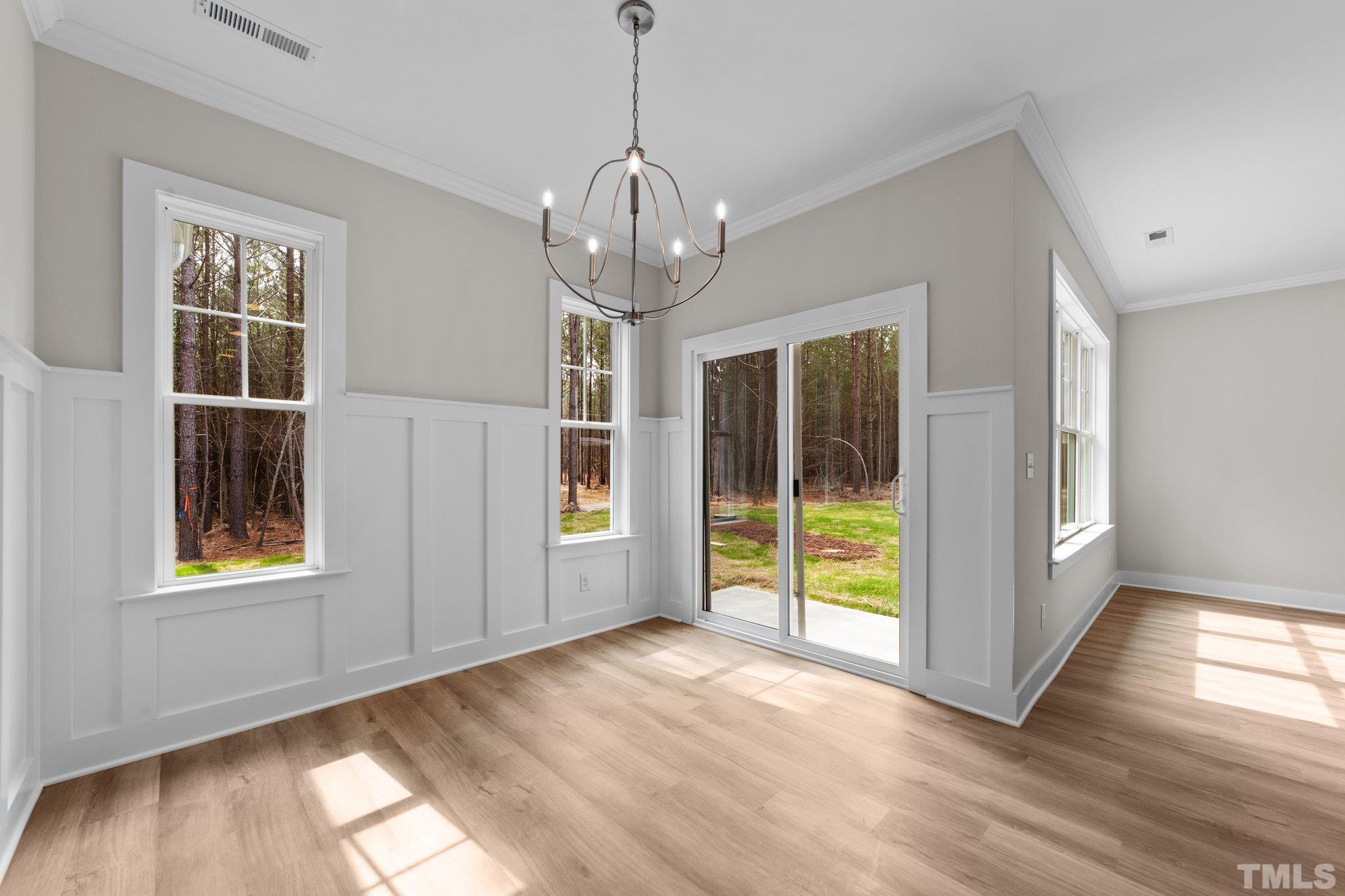 2748 Antioch Church Road Timberlake, NC 27583 - Photo 23 of 45 a view of empty room with wooden floor and fan