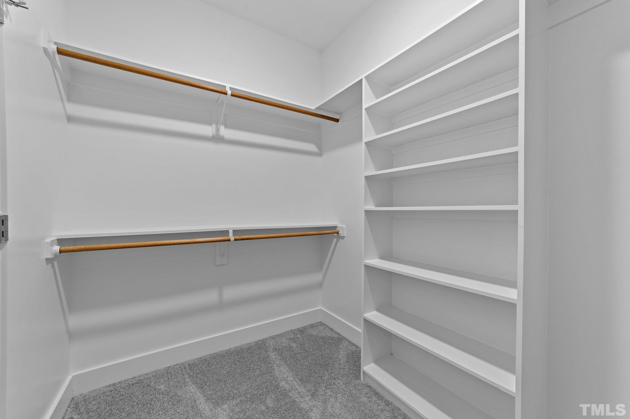 2748 Antioch Church Road Timberlake, NC 27583 - Photo 30 of 45 a view of walk in closet with empty racks