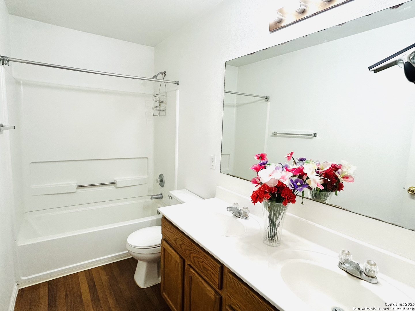 11023 Falling Water San Antonio, TX 78249 - Photo 26 of 30 a bathroom with a sink toilet and shower