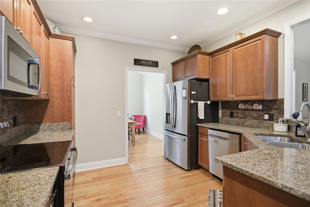 106 Cardinal Drive Seneca, SC 29672 - Photo 13 of 48 This spacious culinary haven offers abundant storage and modern conveniences for delightful meal preparation.