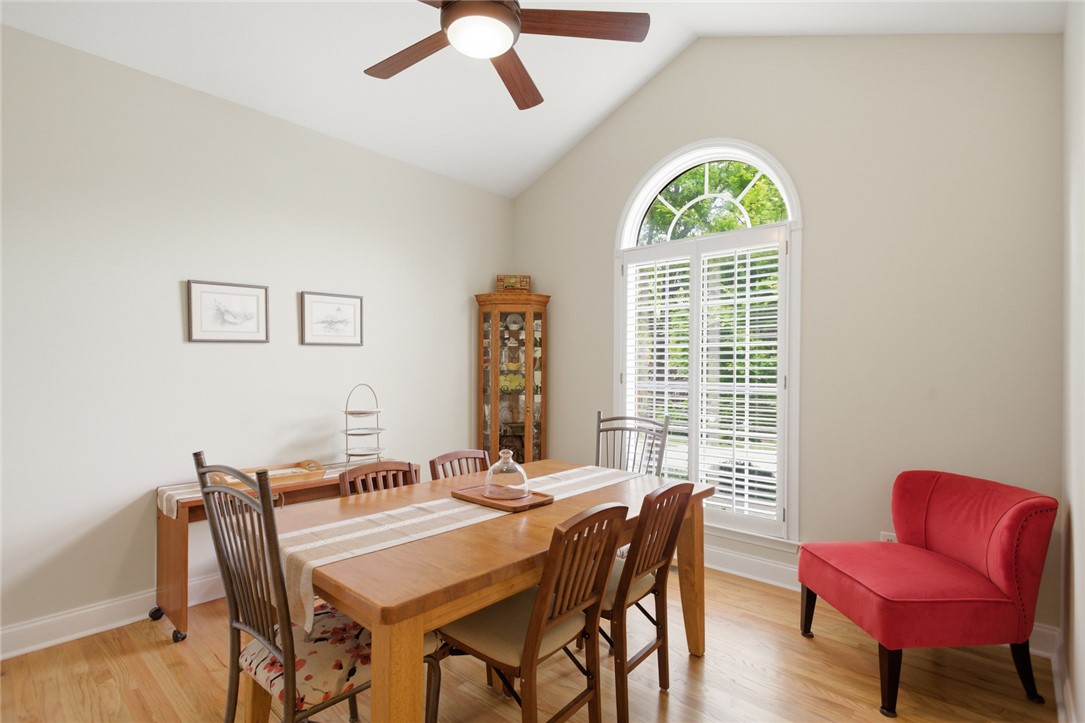 106 Cardinal Drive Seneca, SC 29672 - Photo 14 of 48 This bright dining area features an arched window and warm wood flooring.