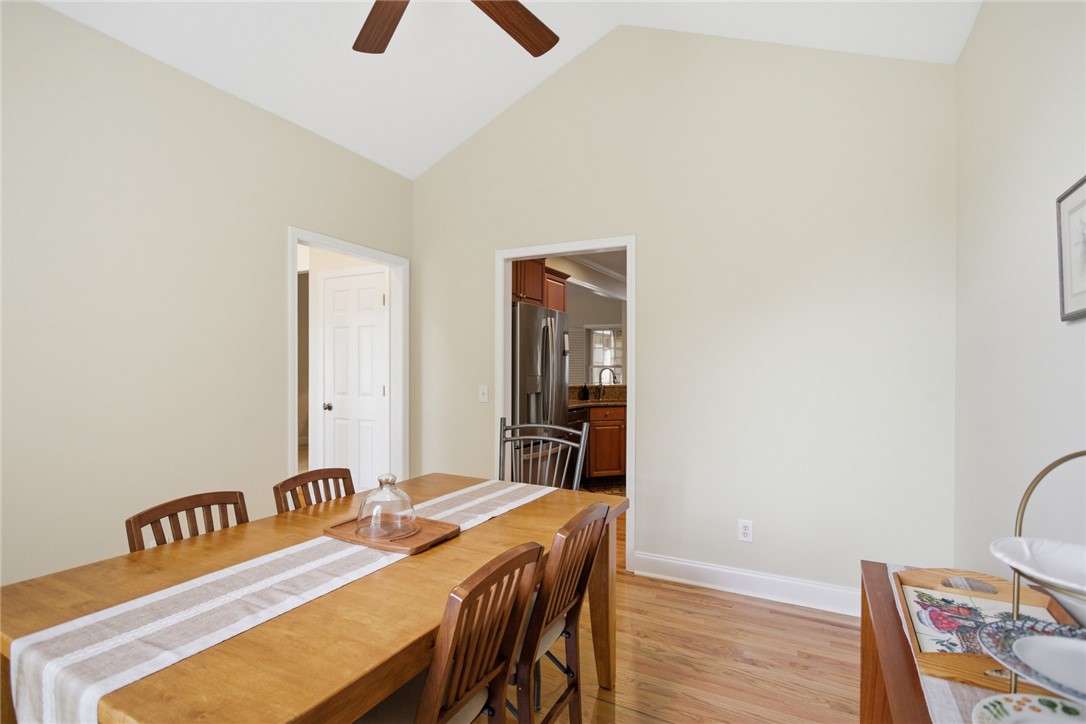 106 Cardinal Drive Seneca, SC 29672 - Photo 15 of 48 This dining area features vaulted ceilings and rich hardwood flooring, perfect for memorable gatherings.